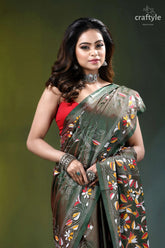 Rifle green multithread floral motif silk kantha stitch saree woman wears dark green saree 2