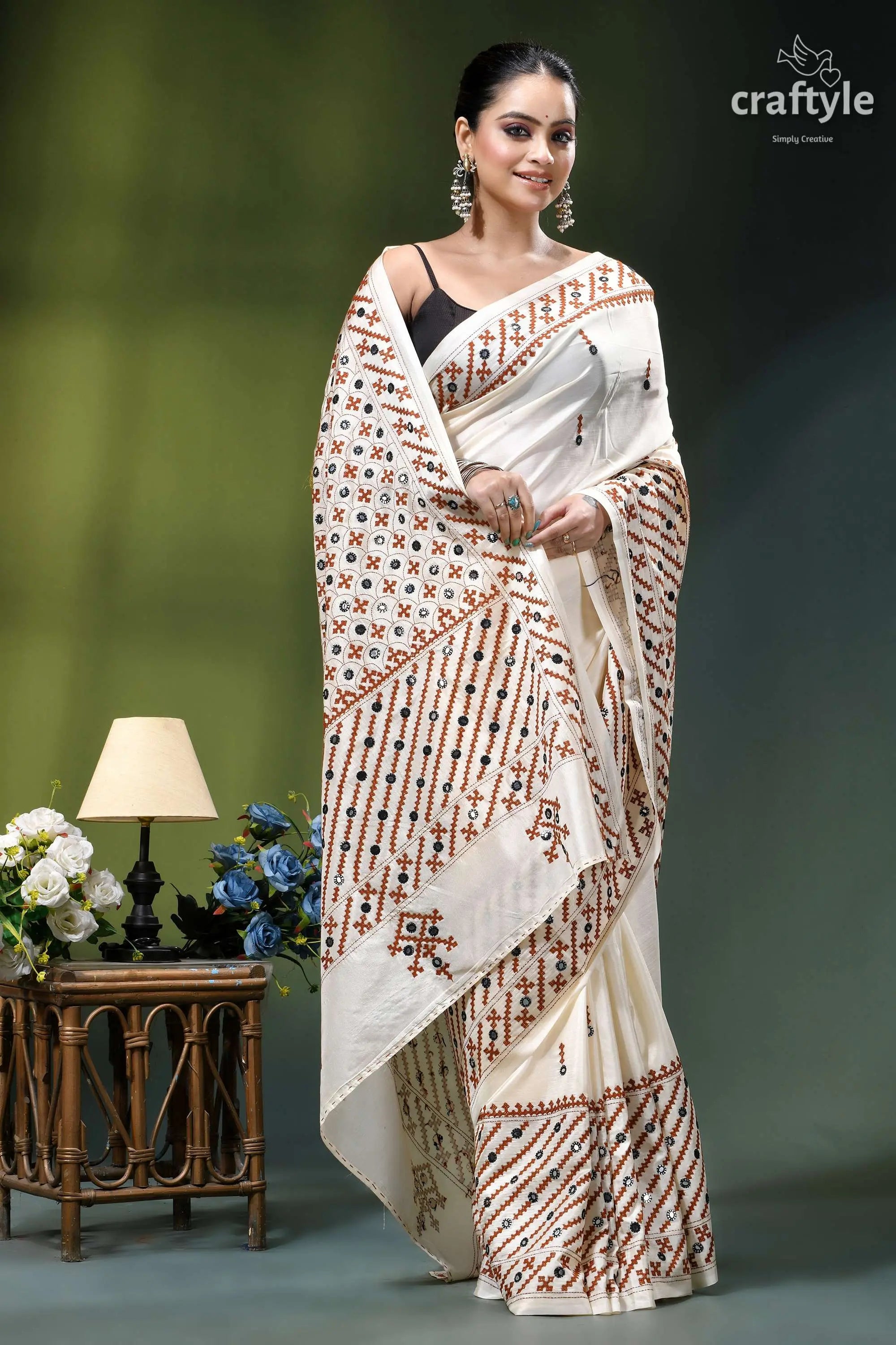 Rose white hand kutch embroidery silk saree - mirror detailing woman wears cream-colored saree intricate 4