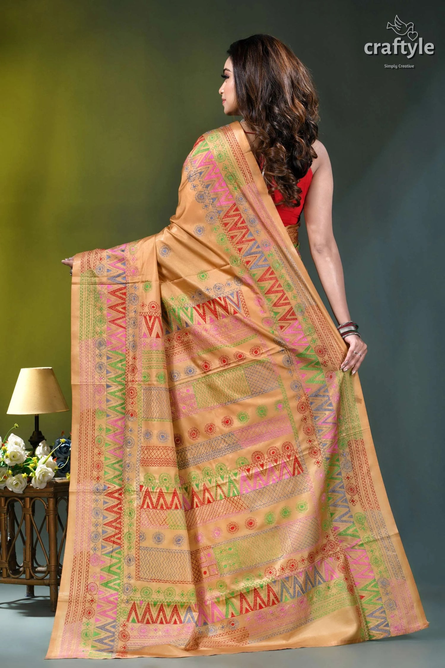 Sand brown silk saree with multi-thread lambani embroidery woman wears peach-colored saree intricate 5