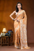 Sand brown white thread floral design handcrafted silk kantha saree woman wears golden-orange silk saree 1
