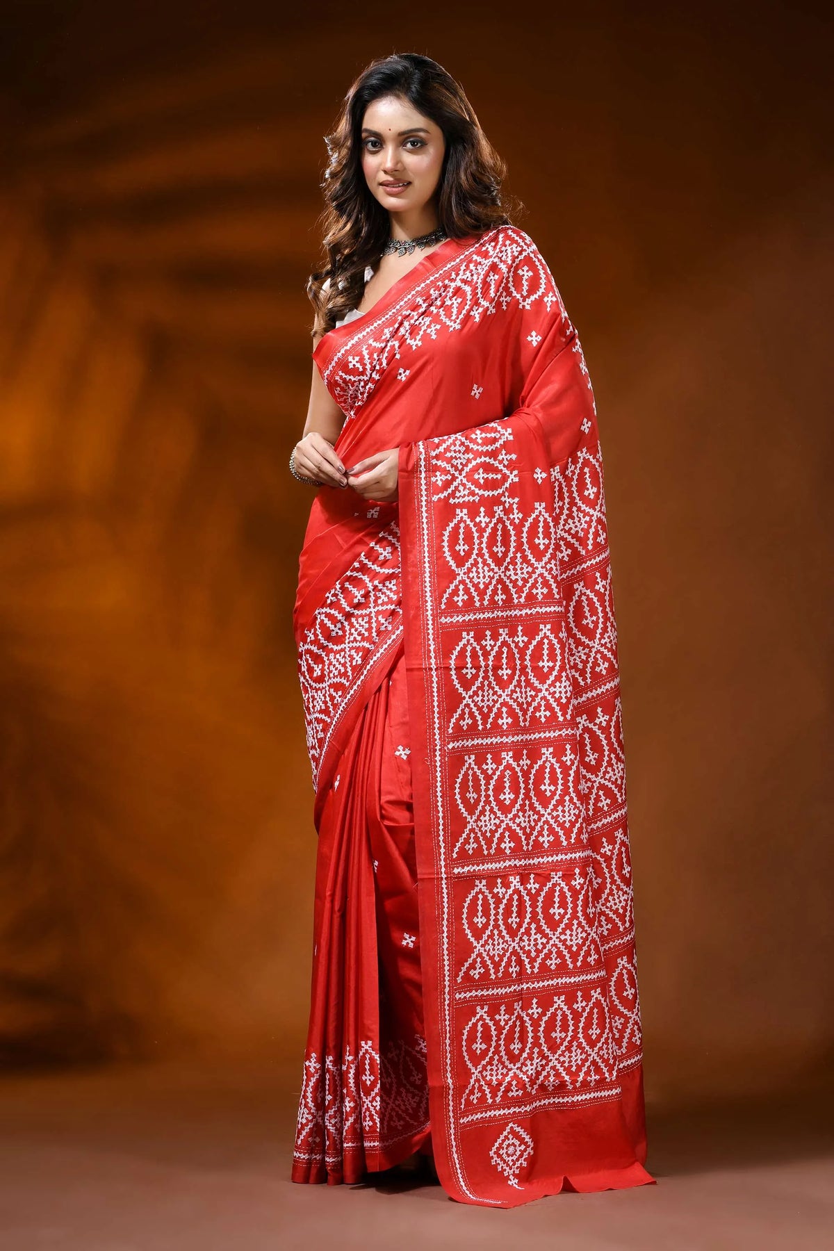 Scarlet red kutch work saree in silk with hand embroidered ethnic motif 1