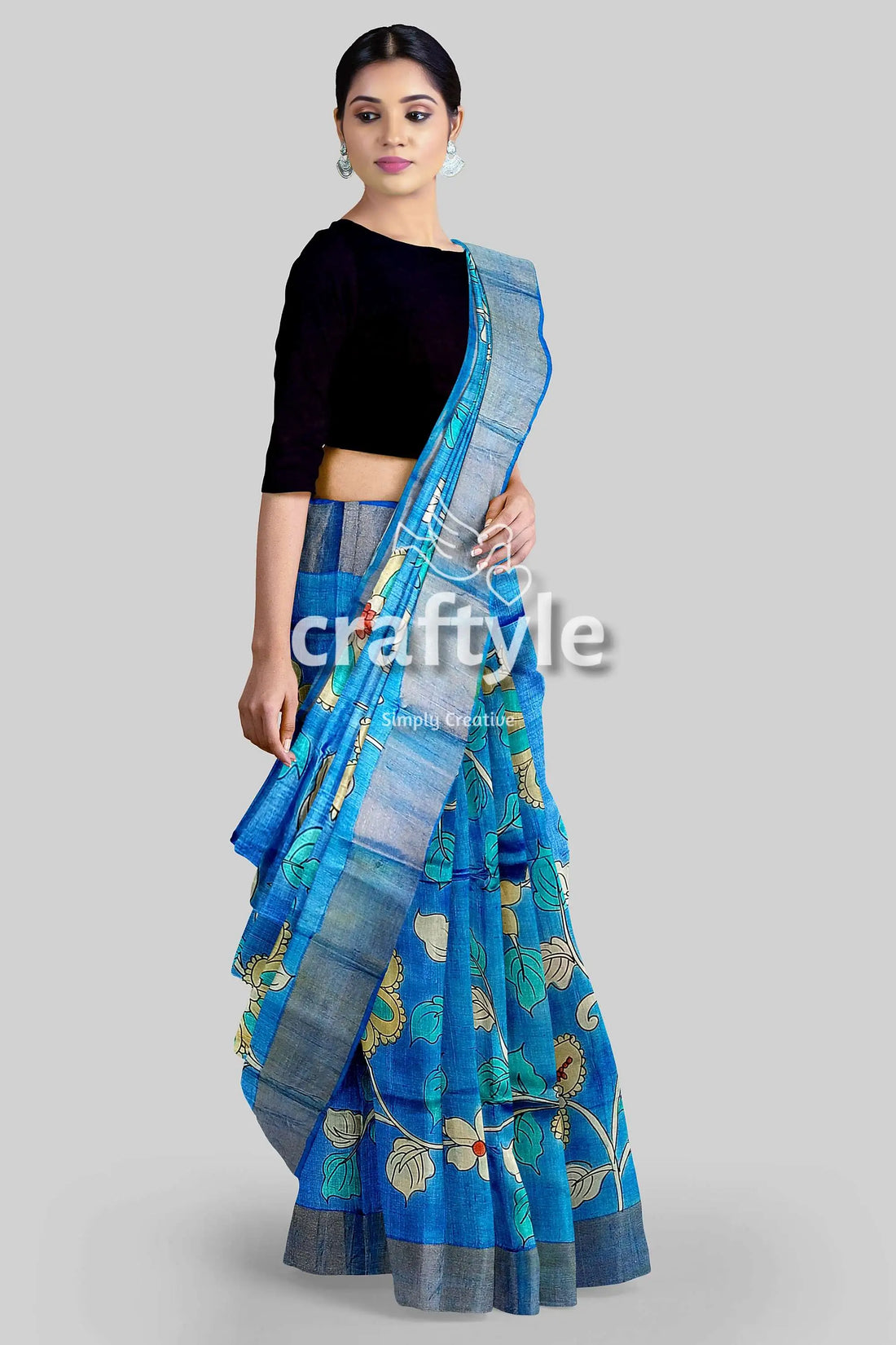 Sky blue handcrafted pure tussar kalamkari saree with zari border blue floral saree silver border 1