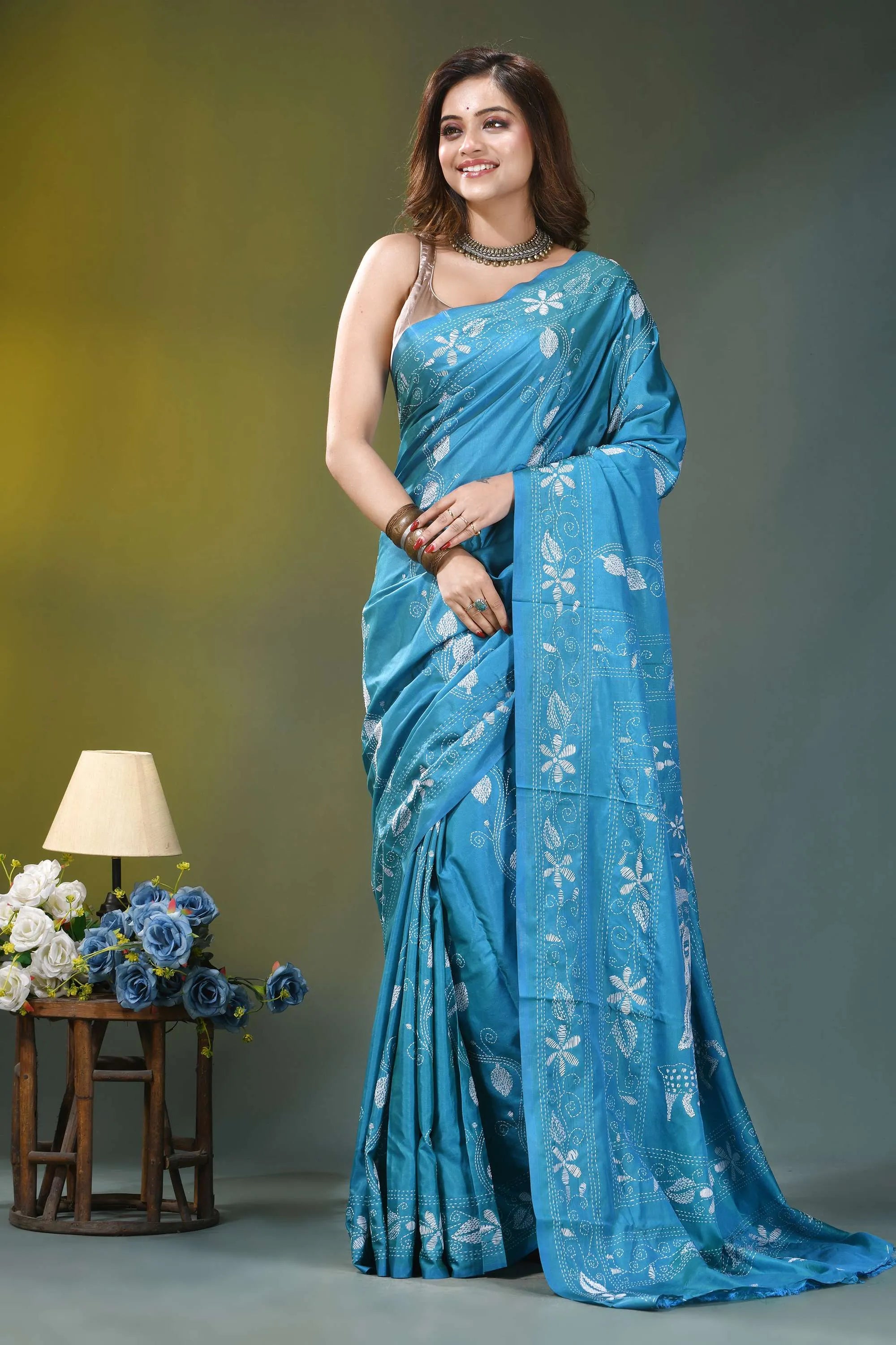 Sky blue nature theme artisanal silk kantha work saree woman wears vibrant blue silk 2