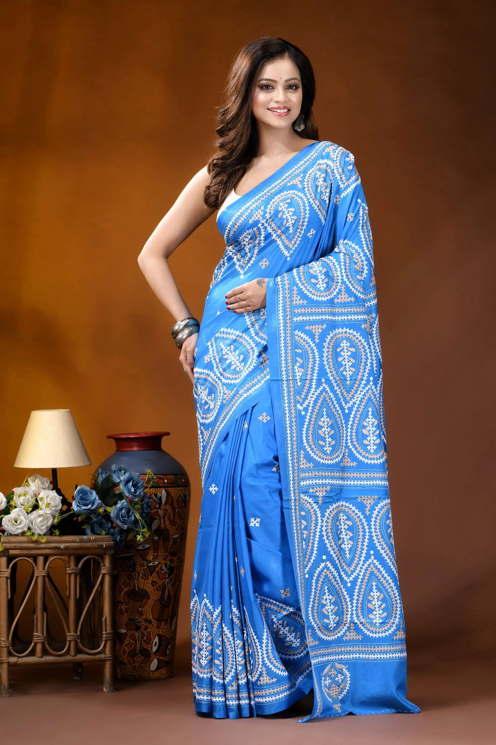Sky blue paisley motif handcrafted kutch embroidered silk saree vibrant blue saree intricate white 1
