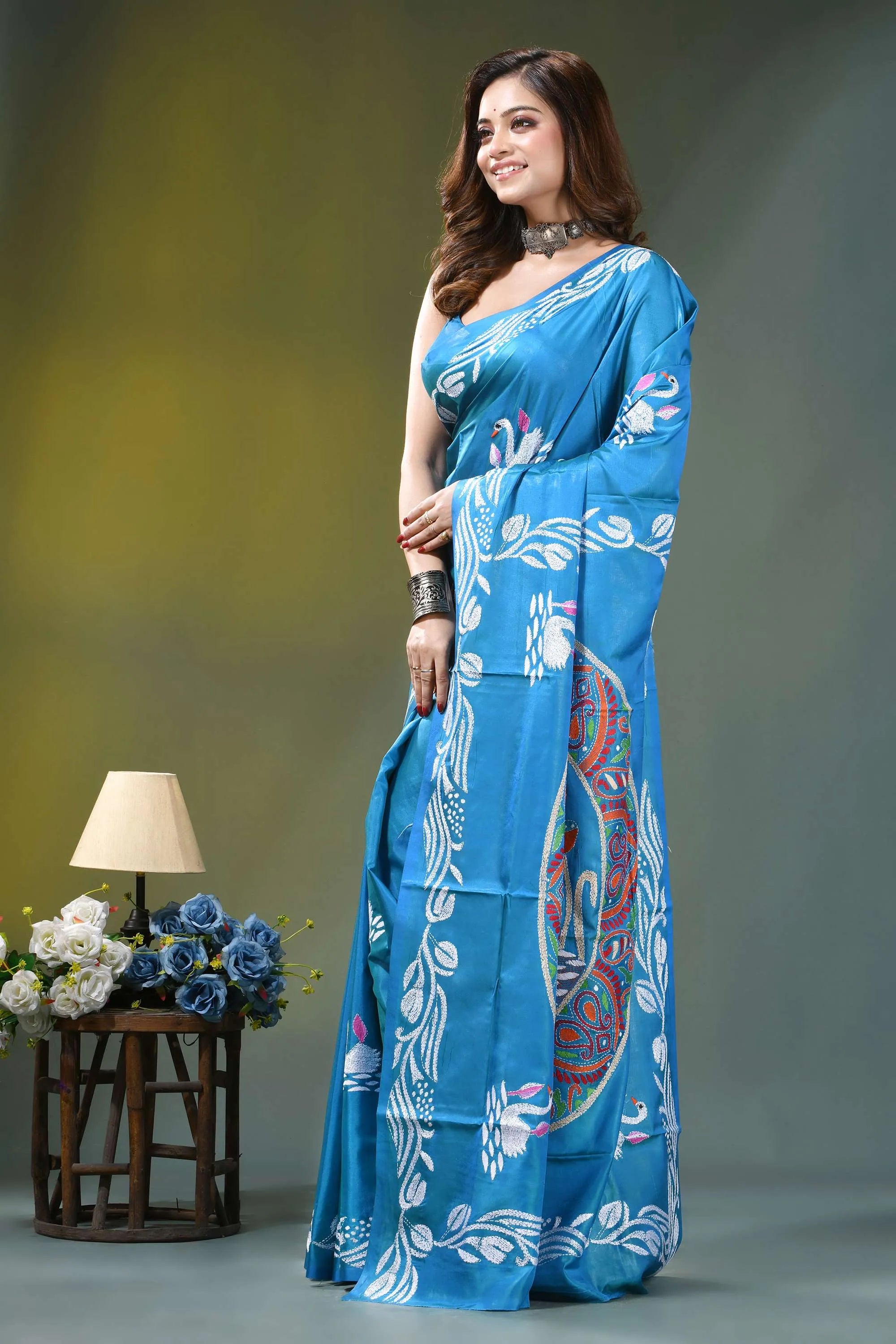 Sky blue swan motif hand embroidered silk kantha stitch saree vibrant blue saree intricate white 3