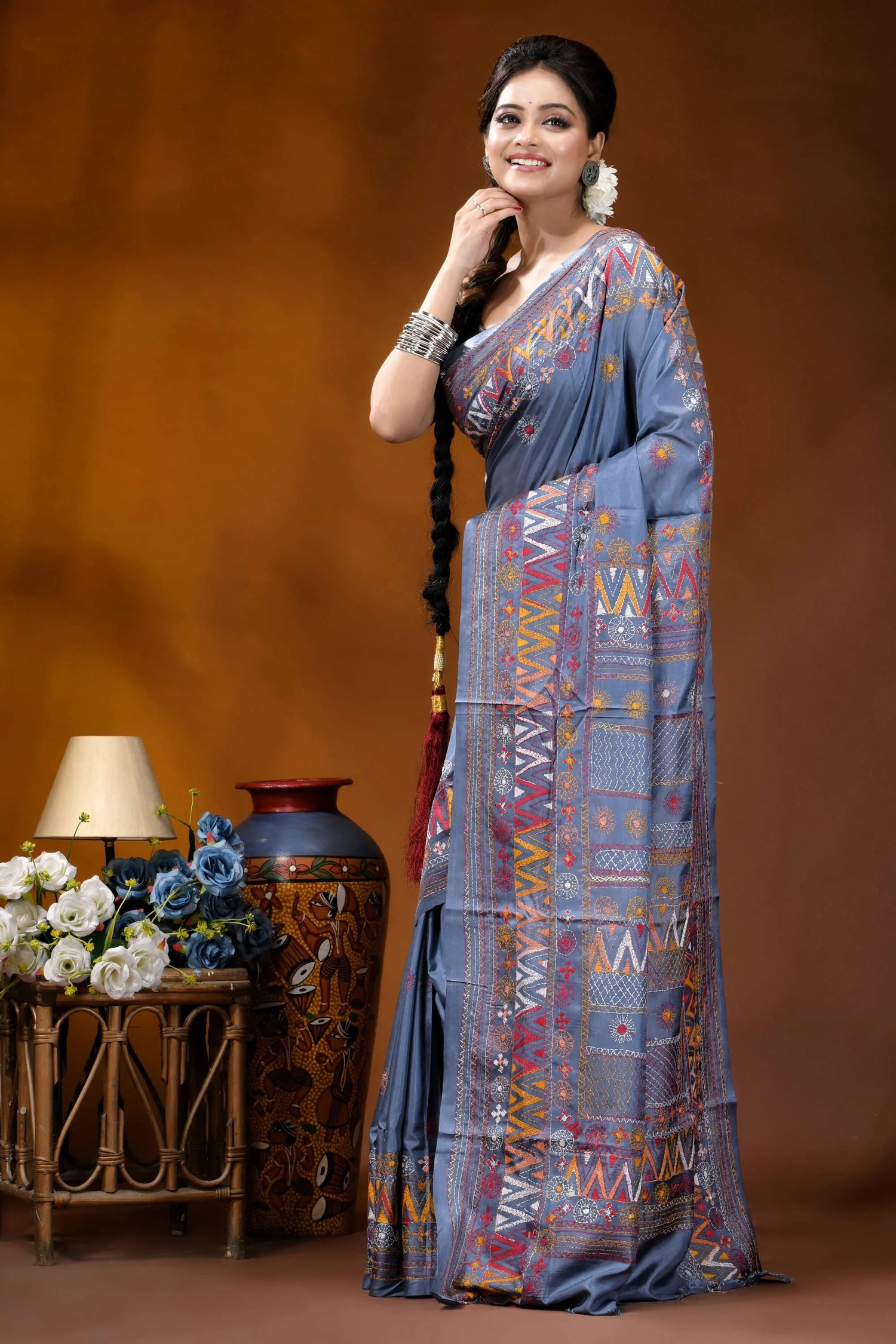 Slate grey multicolor geometric motif silk lambani embroidery saree woman wears blue saree intricate 3