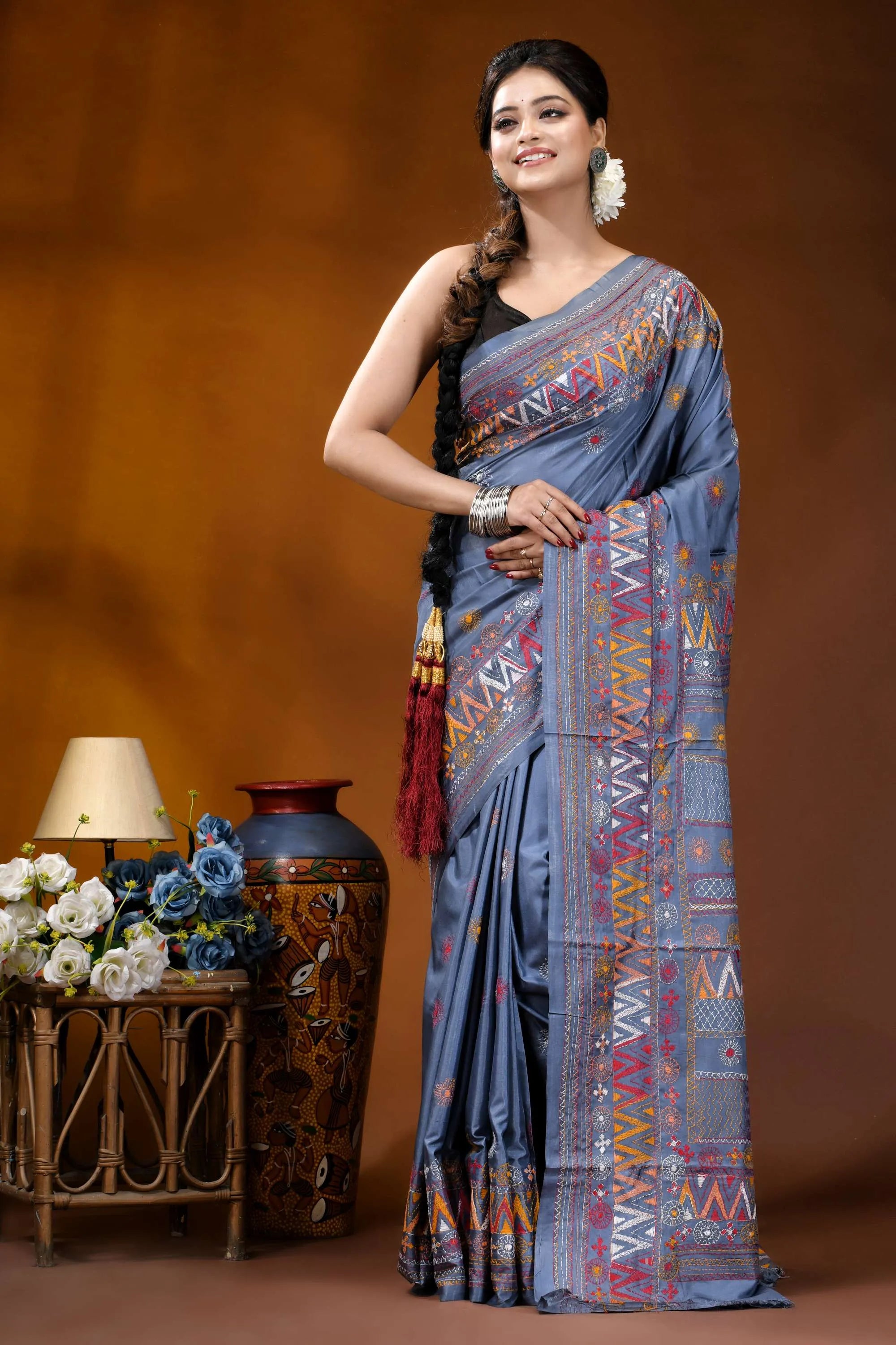 Slate grey multicolor geometric motif silk lambani embroidery saree woman wears blue silk saree 6