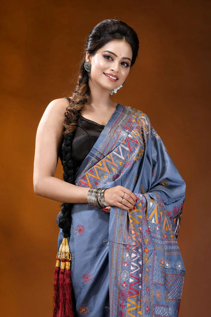 Slate grey multicolor geometric motif silk lambani embroidery saree woman wears blue silk saree 2