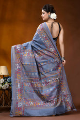 Slate grey multicolor geometric motif silk lambani embroidery saree woman wears light blue saree 5