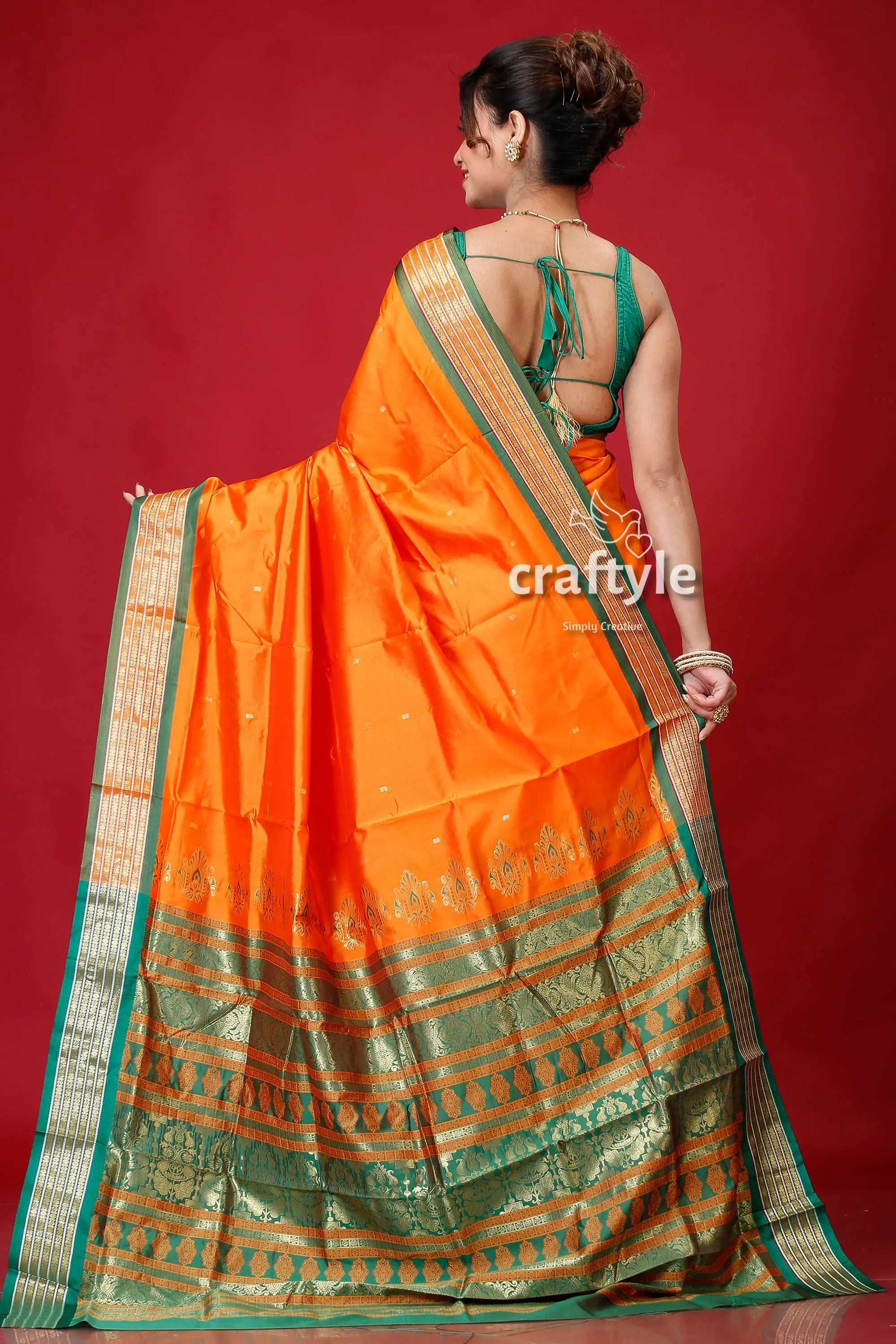 Spanish orange bomkai silk sari featuring golden zari border orange silk saree green gold 5