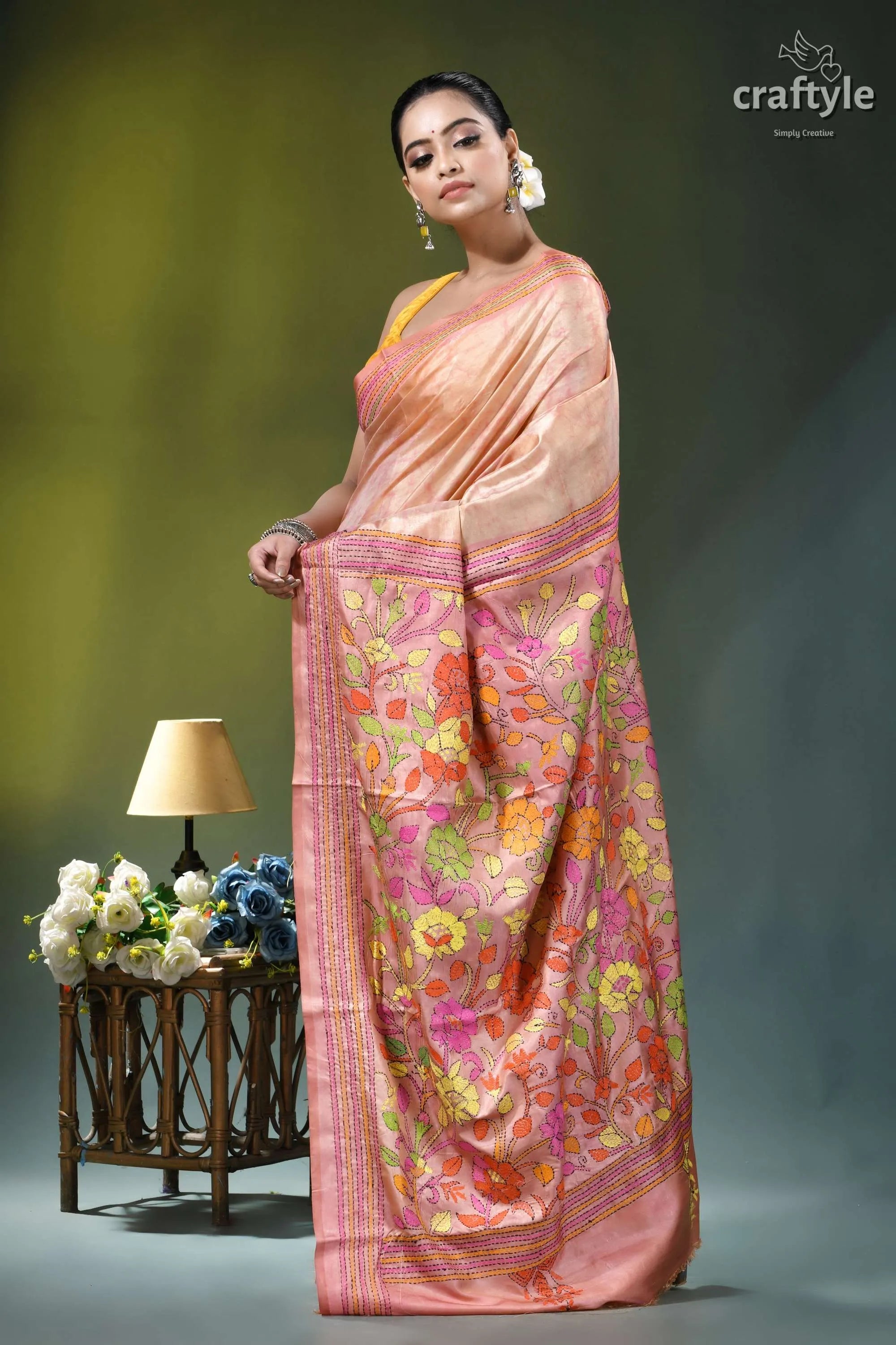 Summer melon floral hand kantha embroidery batik silk saree woman wears peach-colored silk saree 4