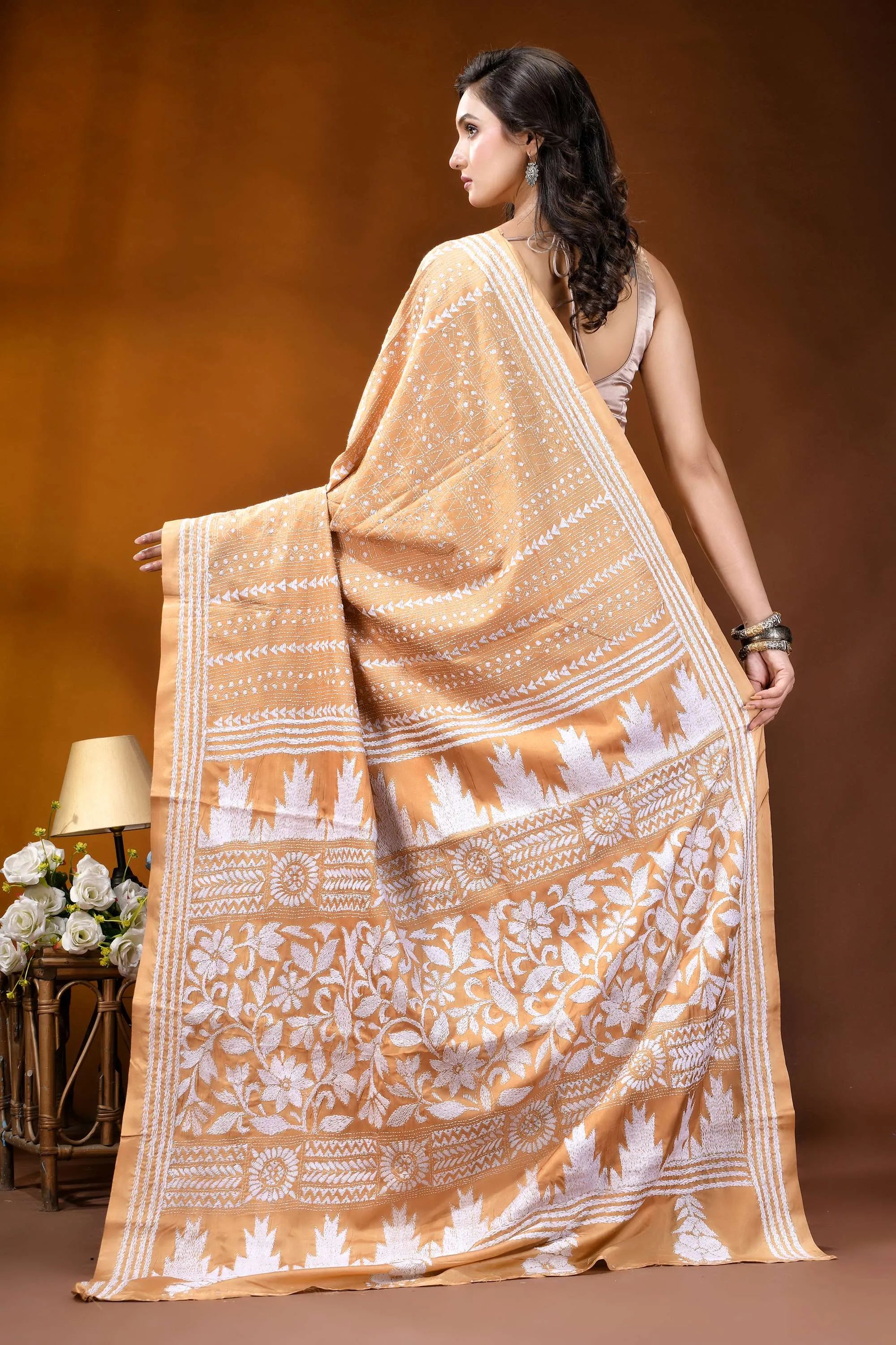 Tan floral motif handcrafted kantha embroidery silk saree woman wears beige white patterned 4