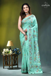 Turquoise green multi-thread floral kantha embroidery silk saree woman wears mint green saree 6