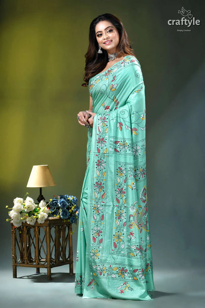 Turquoise green multi-thread floral kantha embroidery silk saree woman wears mint green saree 3