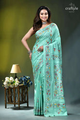 Turquoise green multi-thread floral kantha embroidery silk saree woman wears mint green saree 1