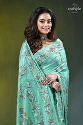 Turquoise green multi-thread floral kantha embroidery silk saree woman wears mint green saree 2