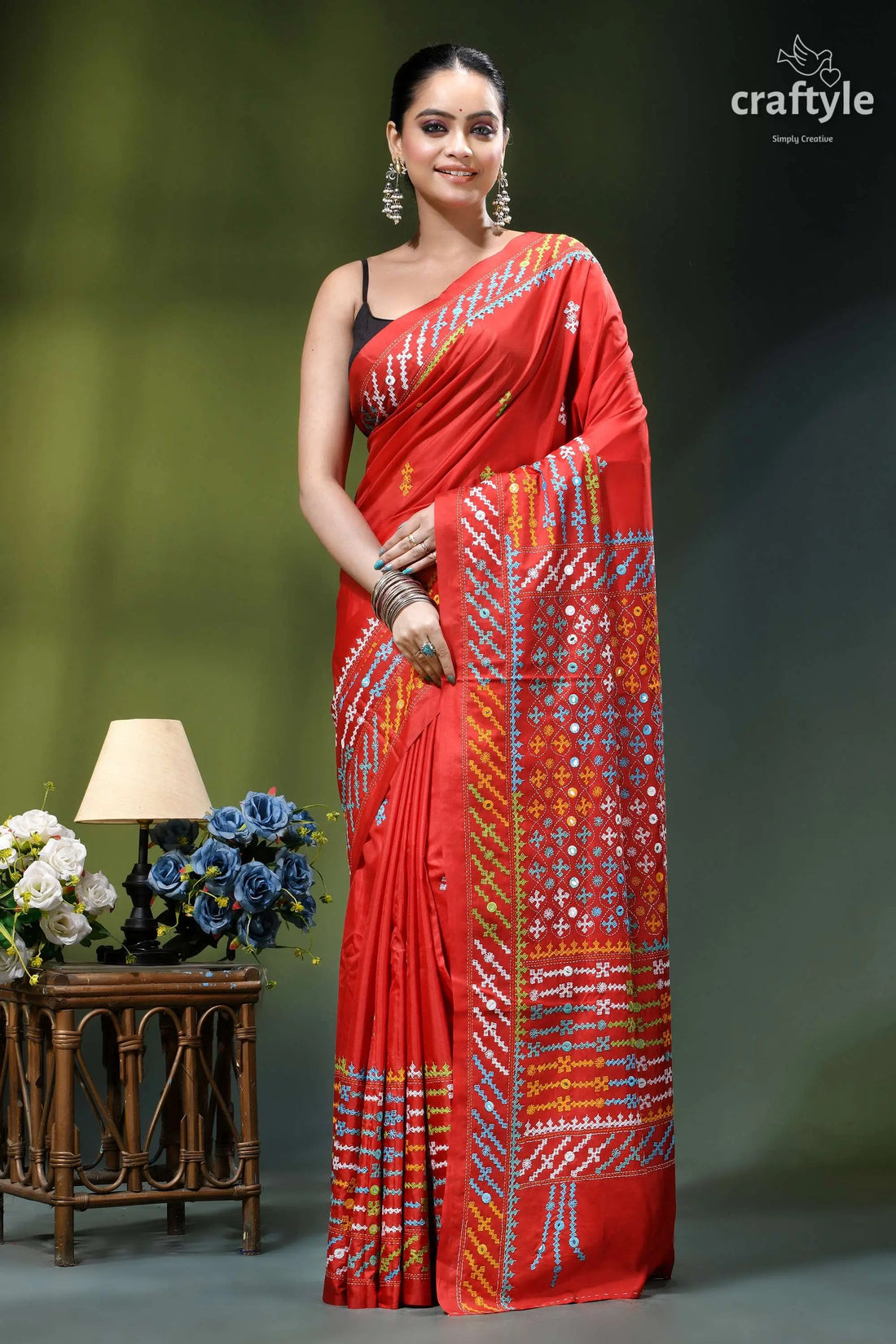 Vivid red intricate gujrati embroidery silk saree with mirror work vibrant red silk saree adorned 1