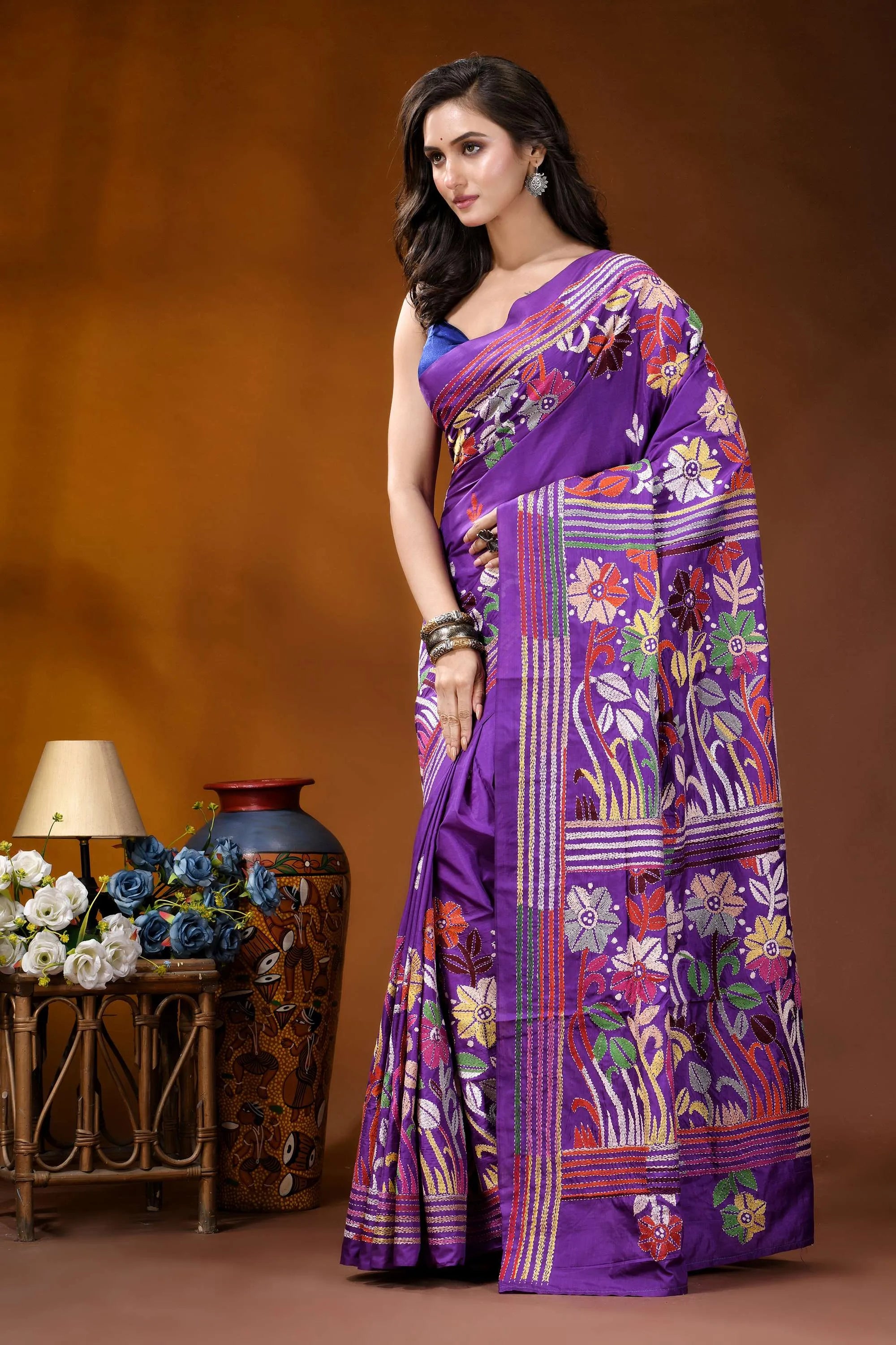 Warm purple floral motif multicolor hand embroidered kantha silk saree woman wears vibrant purple saree 4