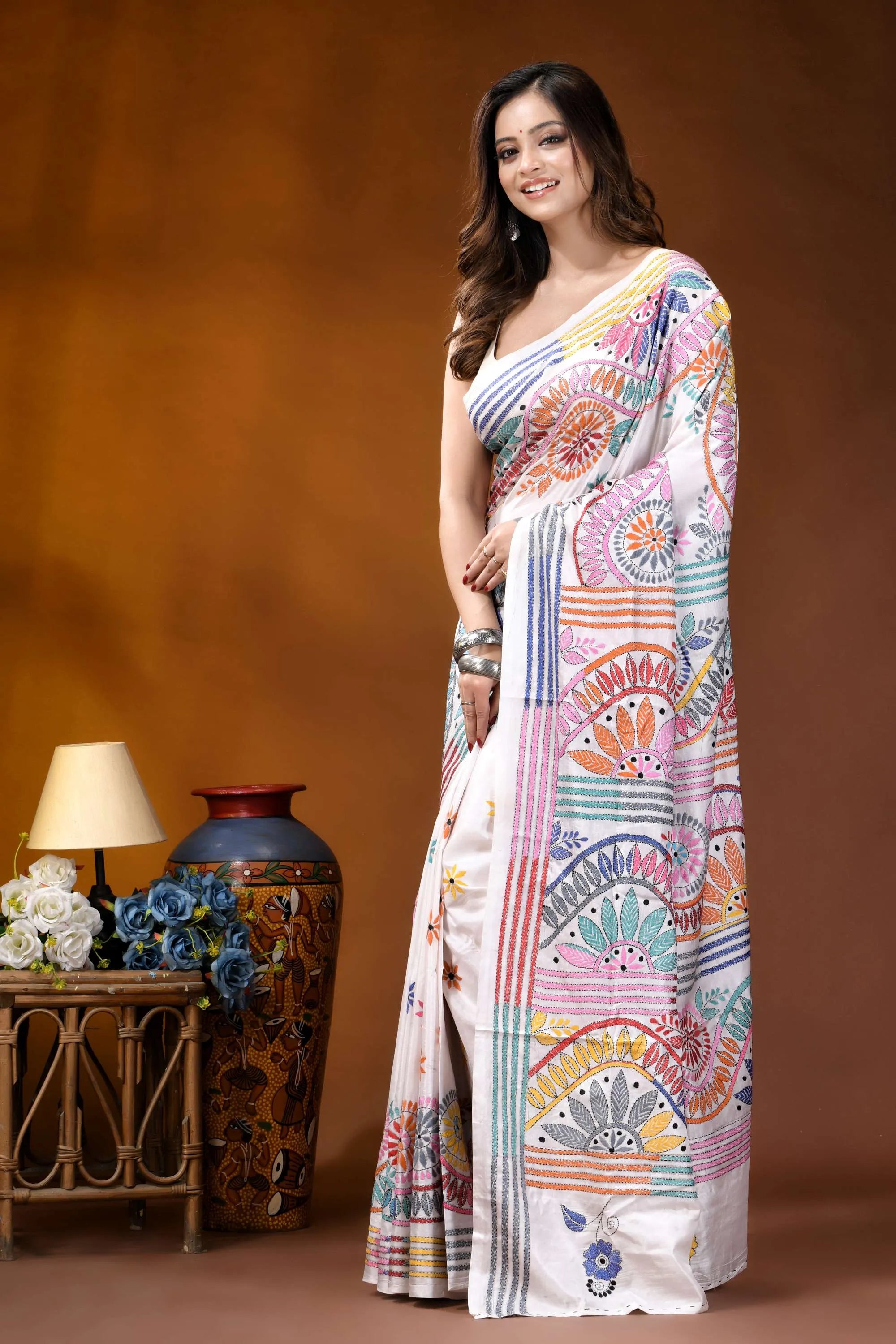 White circular floral design handmade silk kantha stitch saree woman wears white saree adorned 3