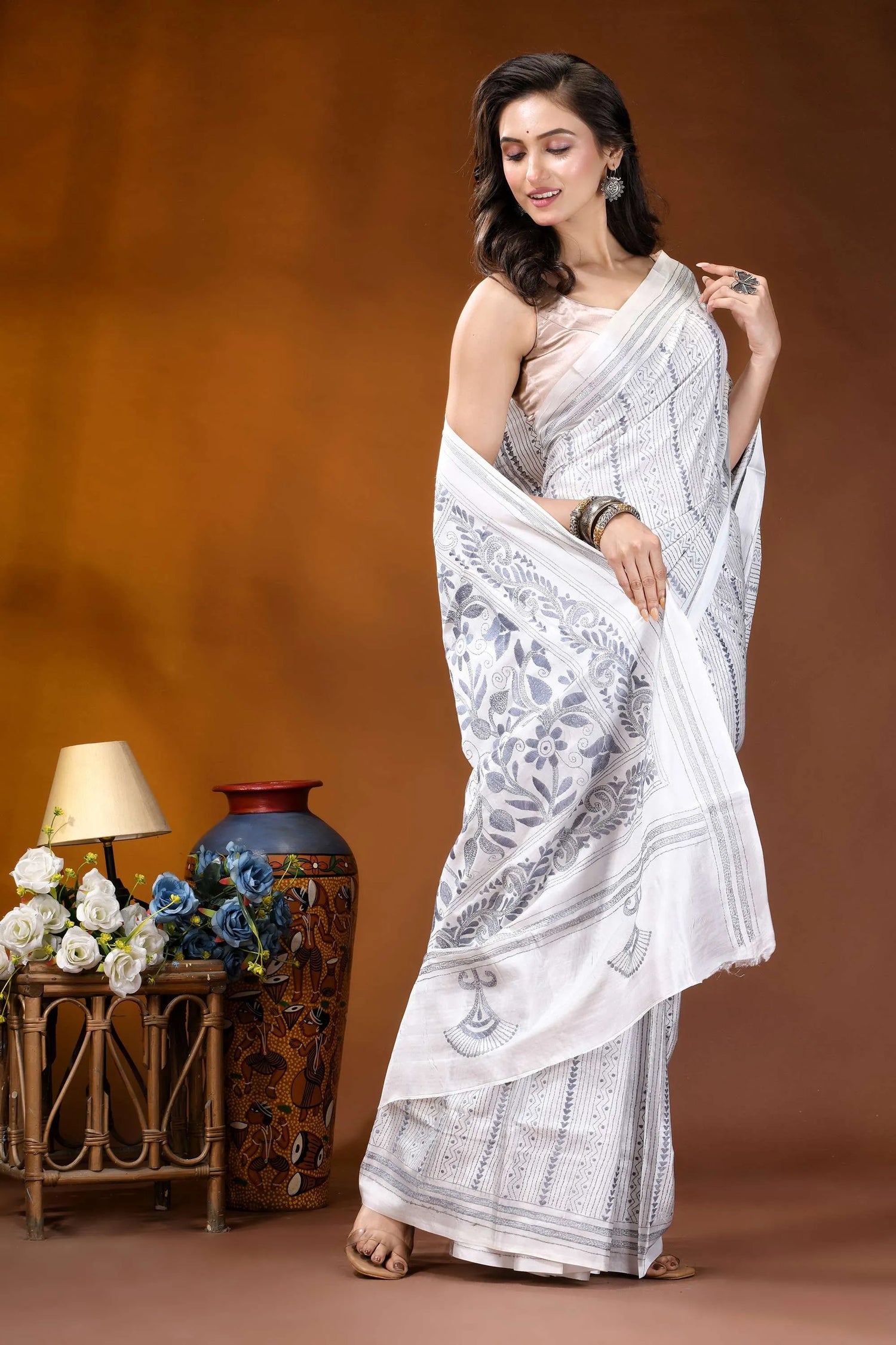 White floral leaf motif hand embroidered kantha silk saree woman wears white saree intricate 4