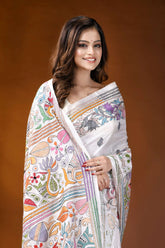 White folk floral design handcrafted silk kantha stitch saree woman wears white saree adorned 2