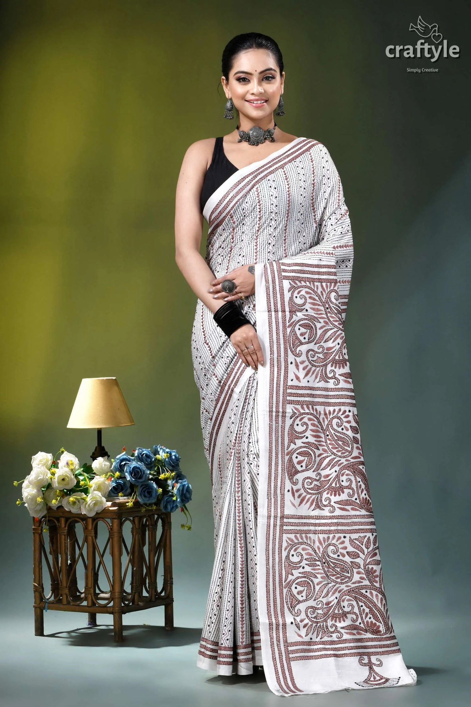 White geometric-floral design silk kantha embroidery saree woman wears white maroon patterned 1