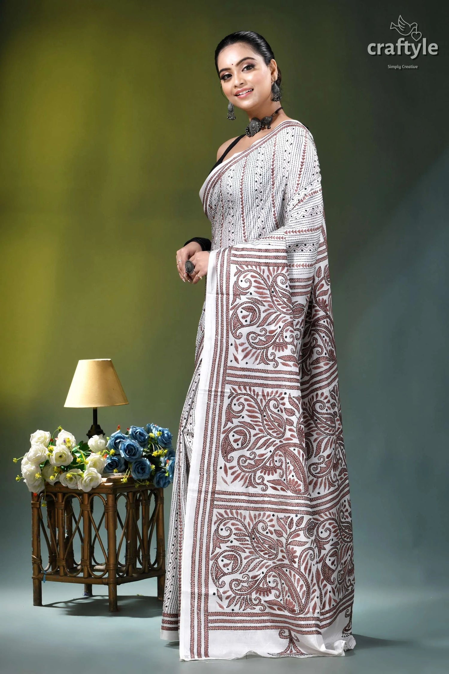 White geometric-floral design silk kantha embroidery saree woman wears white maroon patterned 3