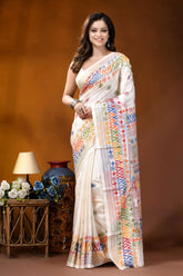 White multi-thread geometric motif hand embroidered lambani silk saree woman wears cream-colored silk saree 1