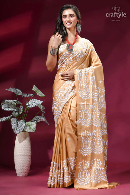 White thread hand gujrati embroidery silk saree in tan color woman wears golden-brown silk saree 6