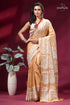 White thread hand gujrati embroidery silk saree in tan color woman wears golden-brown silk saree 1