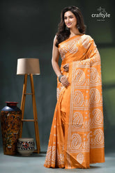 White thread kutch embroidery silk saree in indian yellow orange white paisley patterned saree 3