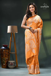 White thread kutch embroidery silk saree in indian yellow orange white paisley patterned saree 4