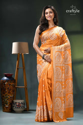 White thread kutch embroidery silk saree in indian yellow orange white paisley patterned saree 1