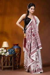 Wine color thread work floral motif handcrafted silk kantha saree in white woman wears white maroon patterned 4