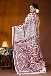 Wine color thread work floral motif handcrafted silk kantha saree in white woman wears white maroon printed 5