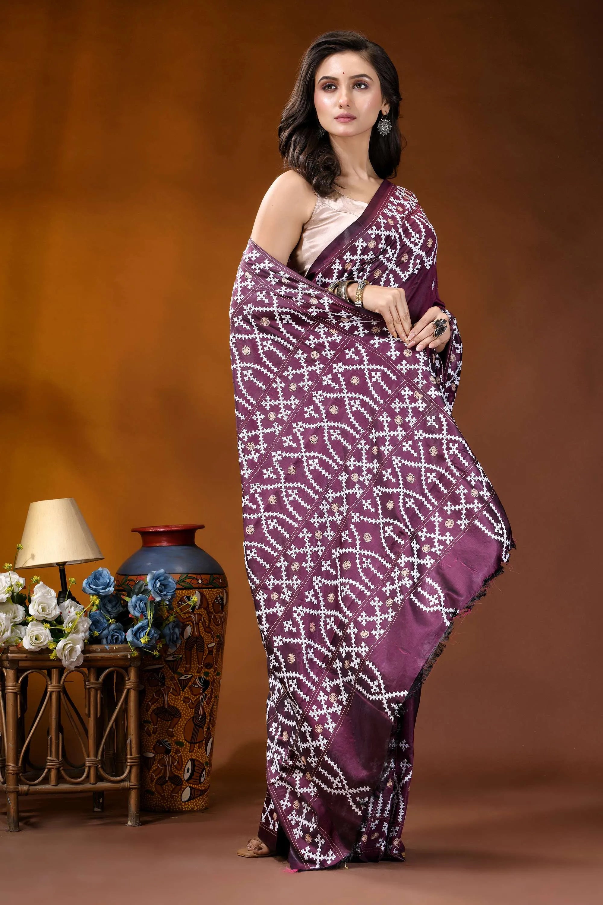 Wine ethnic motif handcrafted kutch embroidery silk saree woman wears rich purple saree 4
