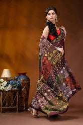 Wine multi-thread floral motif hand embroidered lambani silk saree woman wears maroon gold patterned 4
