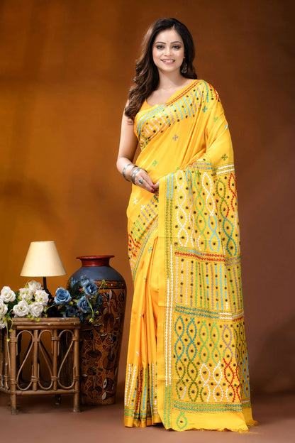 Yellow multi-thread ethnic motif handcrafted gujrati stitch silk saree vibrant yellow saree intricate green 1