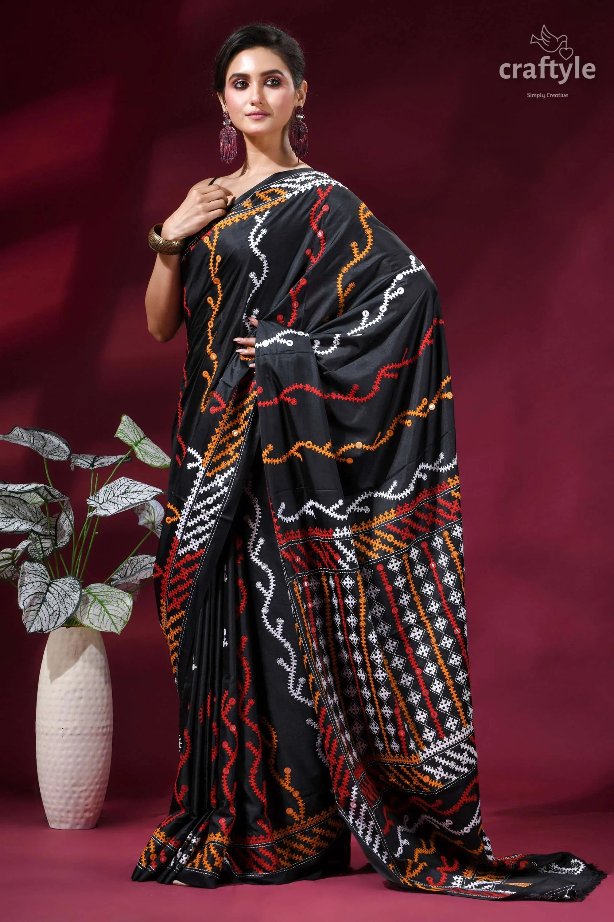 Zade black intricate gujrati stitched silk saree with mirror work black saree intricate red orange 5